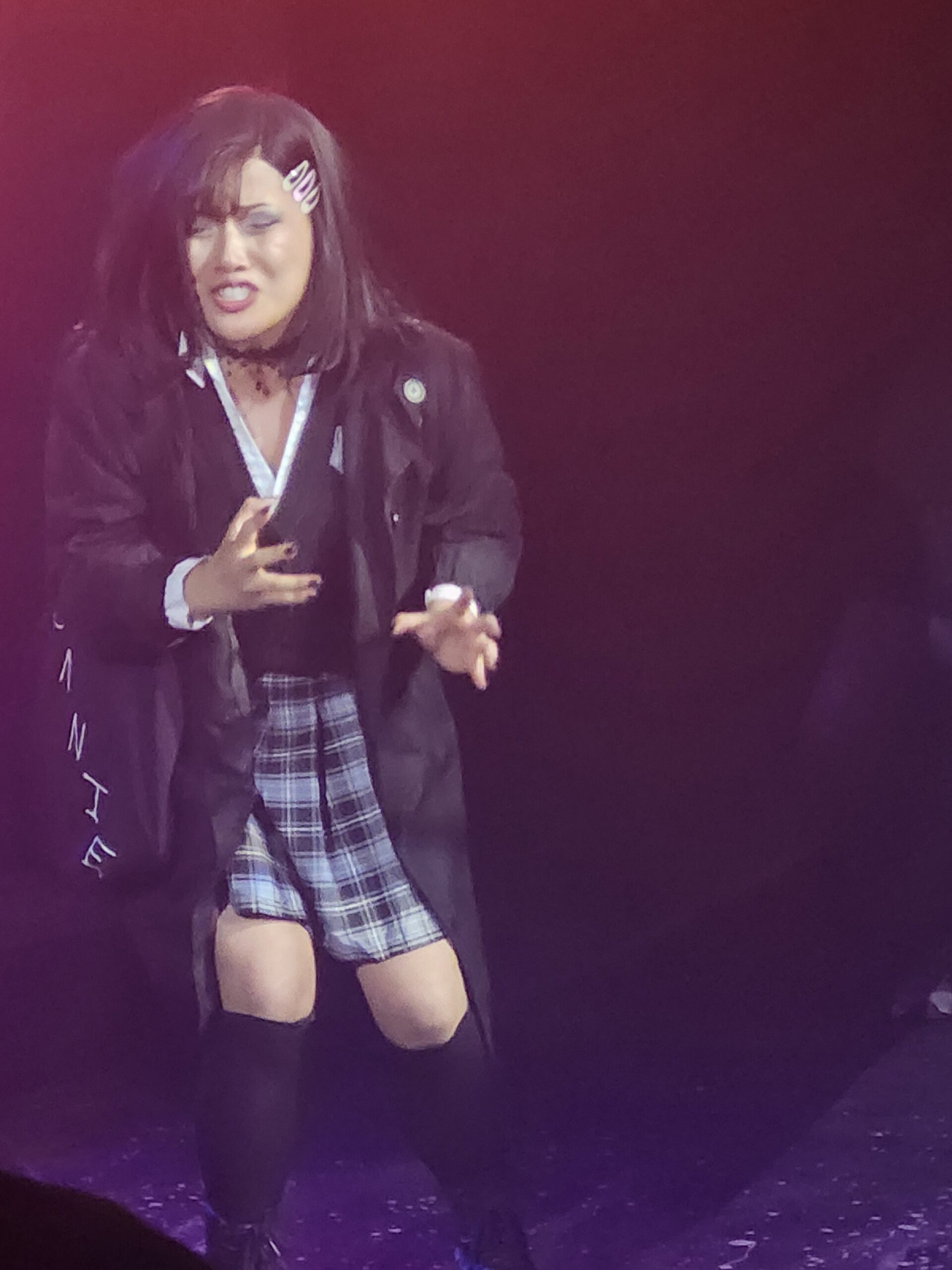 Actress singing dramatically